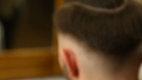 Barber using trimming machine for hair Stock Footage 91214785