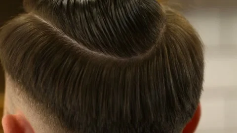 Barber using trimming machine for hair Video stock 91216135