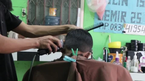 The barber is working. Footage taken in Java Stock Footage 245264777