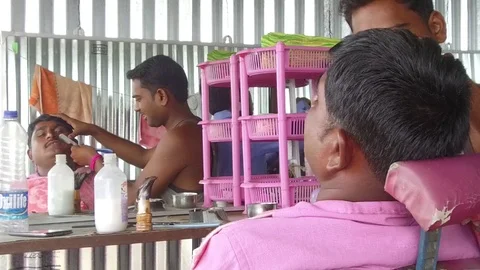 Barber working in his small shop Stock Footage 77572284