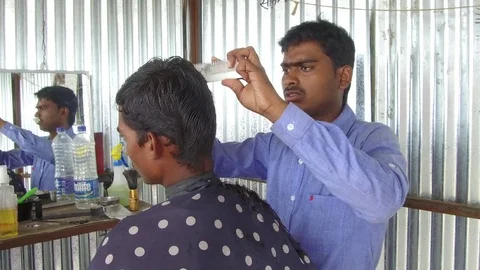 Barber working in his small shop Stock Footage 77649670