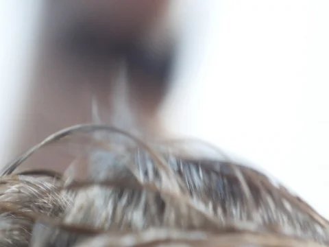 Barbers master makes styling with a comb close up slow motion Stock Footage 72266071