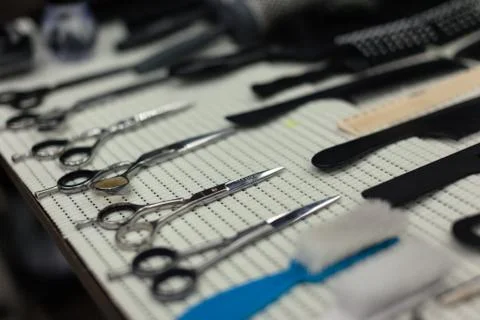 Barber's work table with a set of scissors Stock Photos
