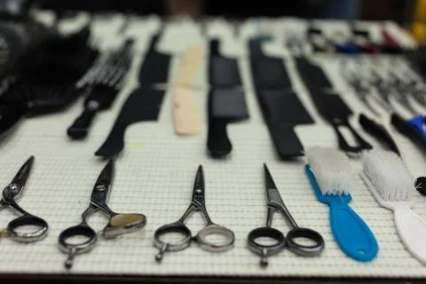 Barber's work table with a set of scissors Stock Photos