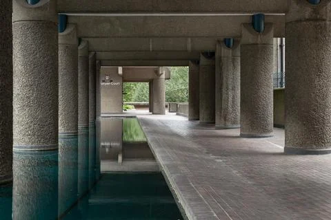 The Barbican's design, including the large, textured concrete pillars line,.. Stock Photos