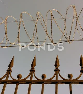 Barbwire on sky background Stock Photos