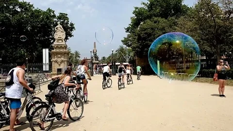 Barcelona cyclists and bubbles Stock Footage 78484659