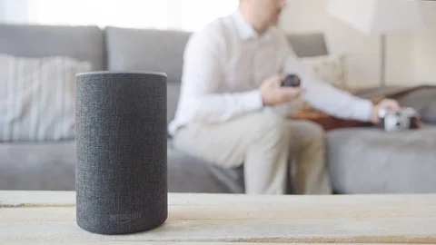 BARCELONA - June 2019: Amazon Echo Smart Home and a man with a camera Stock Footage 109606695