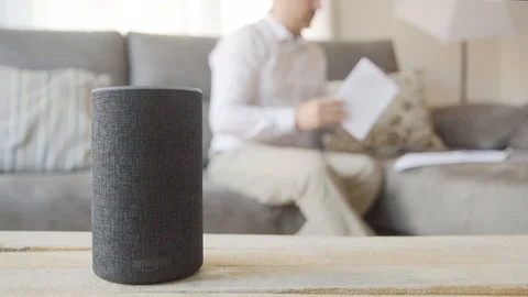 BARCELONA - June 2019: Amazon Echo Smart and a man with some paperwork Stock Footage 109607171
