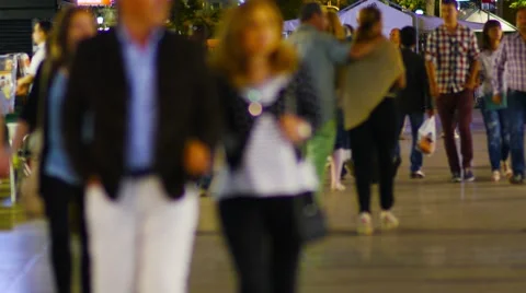 BARCELONA, multiple tourists strolling on Rambla boulevard at night. Video stock 54161923