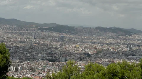 Barcelona skyline trees in foreground Stock Footage 39903493