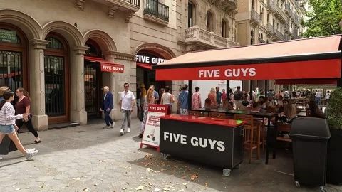 Barcelona, Spain-August 17, 2025. Customers dining at the outdoor terrace o.. Stock Footage 321962053