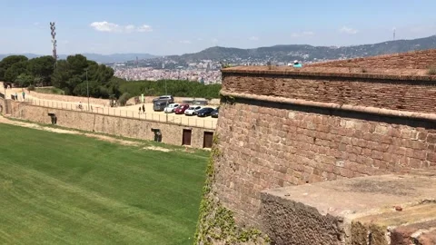 Barcelona, Spain. A large brick building with a mountain in the background Stock Footage 133126439