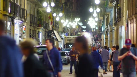 BARCELONA Spain multiple tourists strolling on street at night. Video stock 110976700