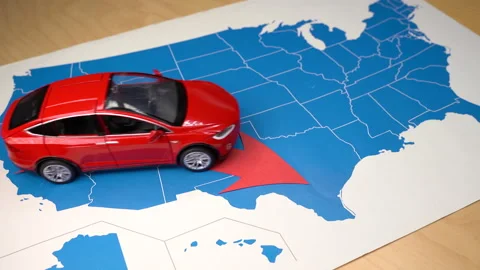 Barcelona, Spain. October 21: Red Tesla Model X toy car over a USA map moving Vídeo Stock 162550488