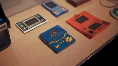 Barcelona, Spain - September 2018: Outdated electronic gadgets for playing games Stock Footage 99974086