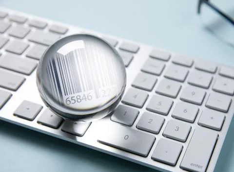 Barcode in clear crystal on white computer keyboard Stock Photos