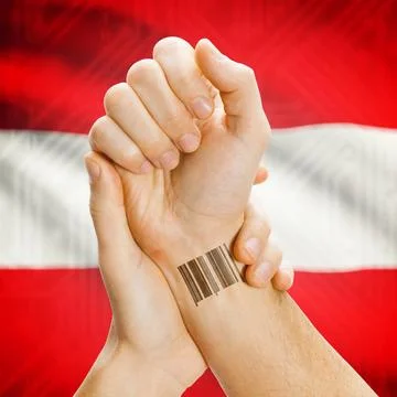 Barcode ID number on wrist and national flag on background - Austria Barco... Stock Photos