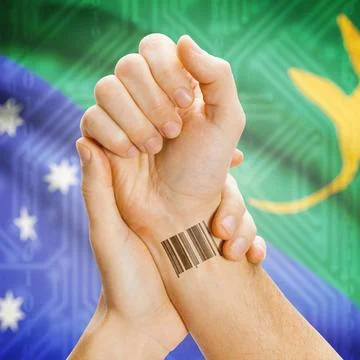 Barcode ID number on wrist and national flag on background - Christmas Isl... Stock Photos