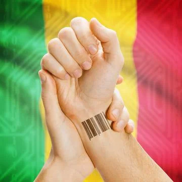 Barcode ID number on wrist and national flag on background - Mali Barcode ... Stock Photos