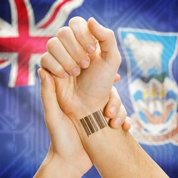 Barcode ID number on wrist and national flag on background - Falkland Isla... Stock Photos