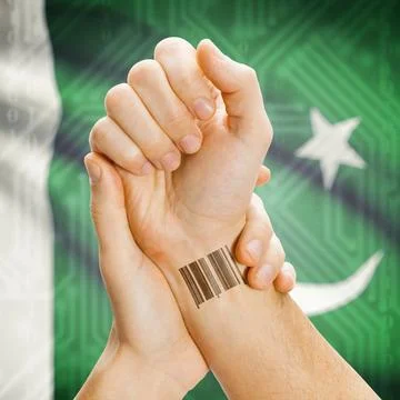 Barcode ID number on wrist and national flag on background - Pakistan Barc... Stock Photos