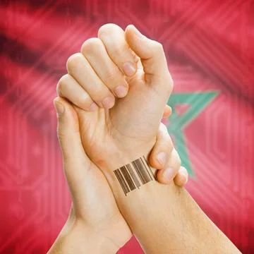 Barcode ID number on wrist and national flag on background - Morocco Barco... Stock Photos