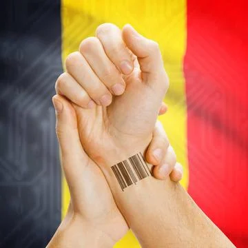 Barcode ID number on wrist and national flag on background - Belgium Barco... Stock Photos