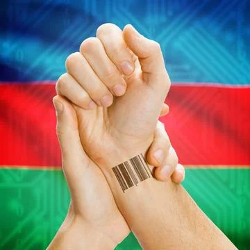 Barcode ID number on wrist and national flag on background - Azerbaijan Ba... Stock Photos