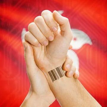 Barcode ID number on wrist and national flag on background - Hong Kong Bar... Stock-Fotos