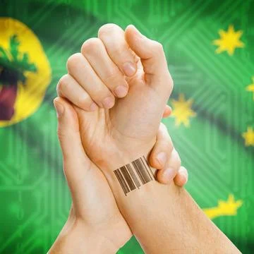 Barcode ID number on wrist and national flag on background - Cocos (Keelin... Stock Photos
