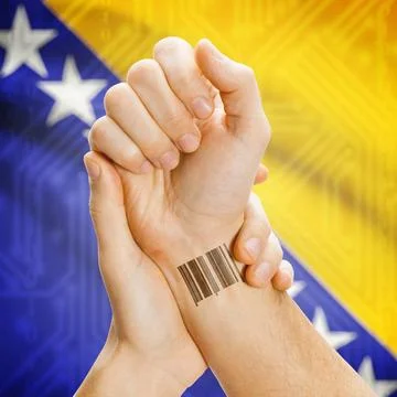 Barcode ID number on wrist and national flag on background - Bosnia and He... Stock Photos