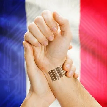 Barcode ID number on wrist and national flag on background - France Barcod... Stock Photos
