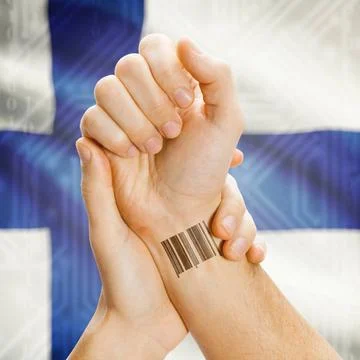 Barcode ID number on wrist and national flag on background - Finland Barco... Stock Photos