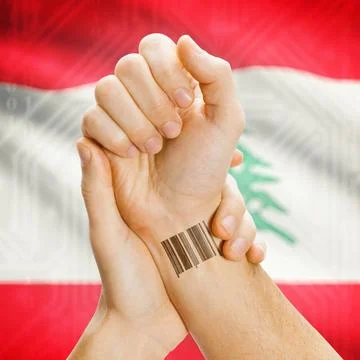 Barcode ID number on wrist and national flag on background - Lebanon Barco... Stock Photos