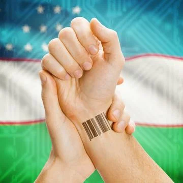 Barcode ID number on wrist and national flag on background - Uzbekistan Ba... Stock Photos