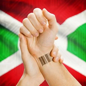 Barcode ID number on wrist and national flag on background - Burundi Barco... Stock Photos