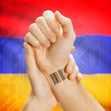 Barcode ID number on wrist and national flag on background - Armenia Barco... Stock Photos