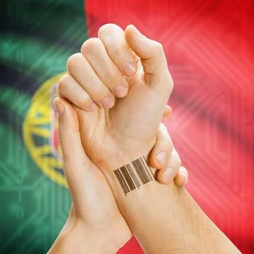 Barcode ID number on wrist and national flag on background - Portugal Barc... Stock Photos