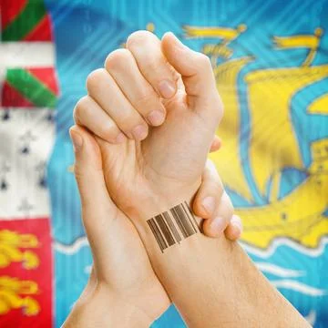 Barcode ID number on wrist and national flag on background - Saint Pierre ... Stock Photos