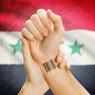 Barcode ID number on wrist and national flag on background - Syria Barcode... Stock-Fotos
