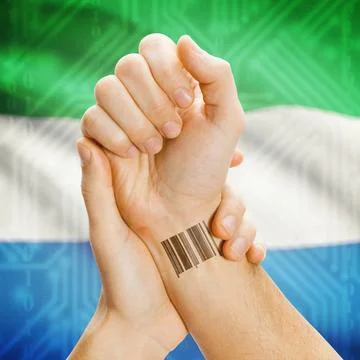 Barcode ID number on wrist and national flag on background - Sierra Leone ... Stock Photos