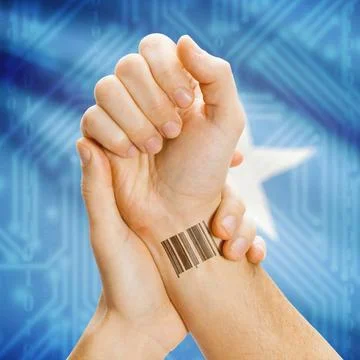 Barcode ID number on wrist and national flag on background - Somalia Barco... Stock Photos