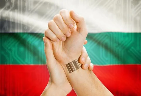 Barcode ID number on wrist of a human and national flag on background - Bulga 스톡 사진