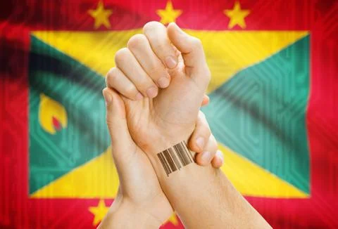 Barcode ID number on wrist of a human and national flag on background - Grena Stock-Fotos