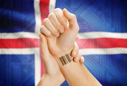 Barcode ID number on wrist of a human and national flag on background - Icela 스톡 사진