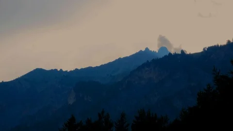 Bardonecchia Alps, clouds move fast behind the peaks at dusk Stock Footage 93867046
