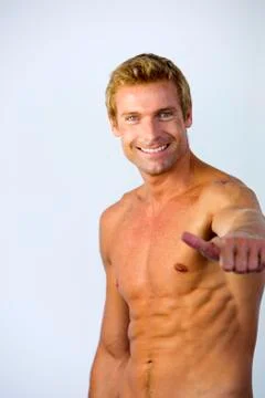 Bare-chested man thumbs up Stock Photos