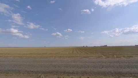 Bare crop field on a sunny spring day in Central Washington Video stock 89579639