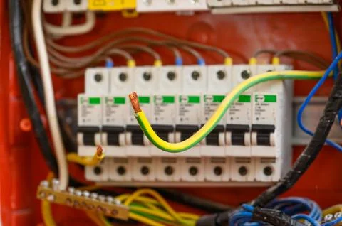 Bare electric wire on the background of the electrical panel. Stock-Fotos